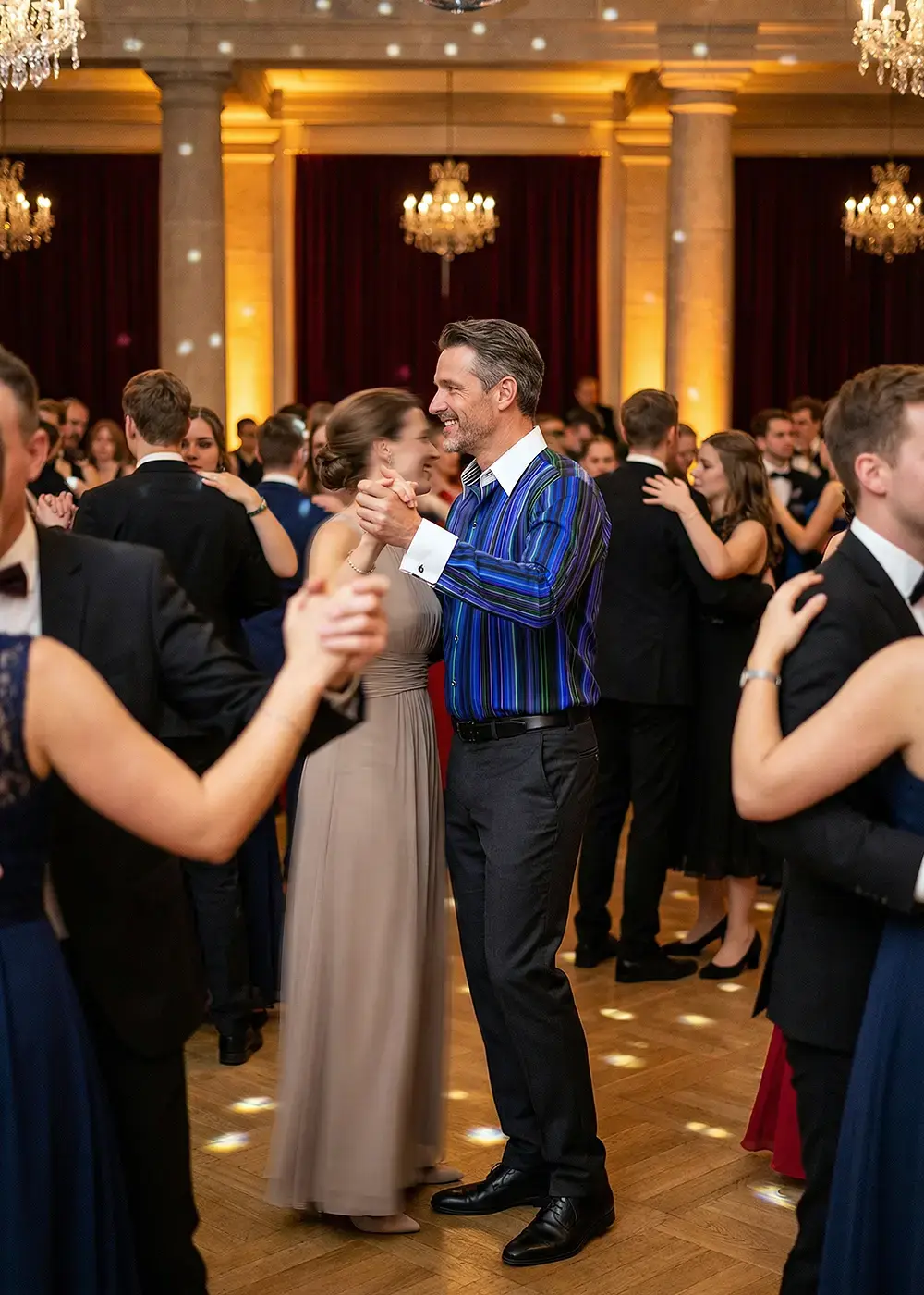 A couple dances during their high school prom. The man is wearing the blue shirt ALPHA CENTAURI BLUE.