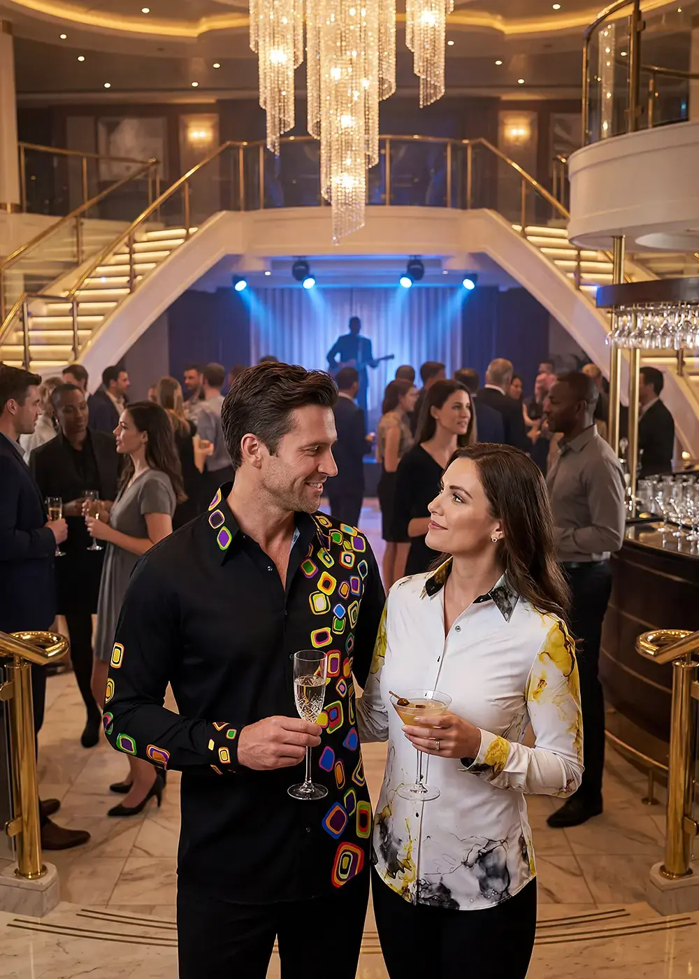 A married couple is on a cruise and attending an evening event. The man is wearing the GERMENS RAINY NIGHT shirt and the woman is wearing the NEBULA blouse.