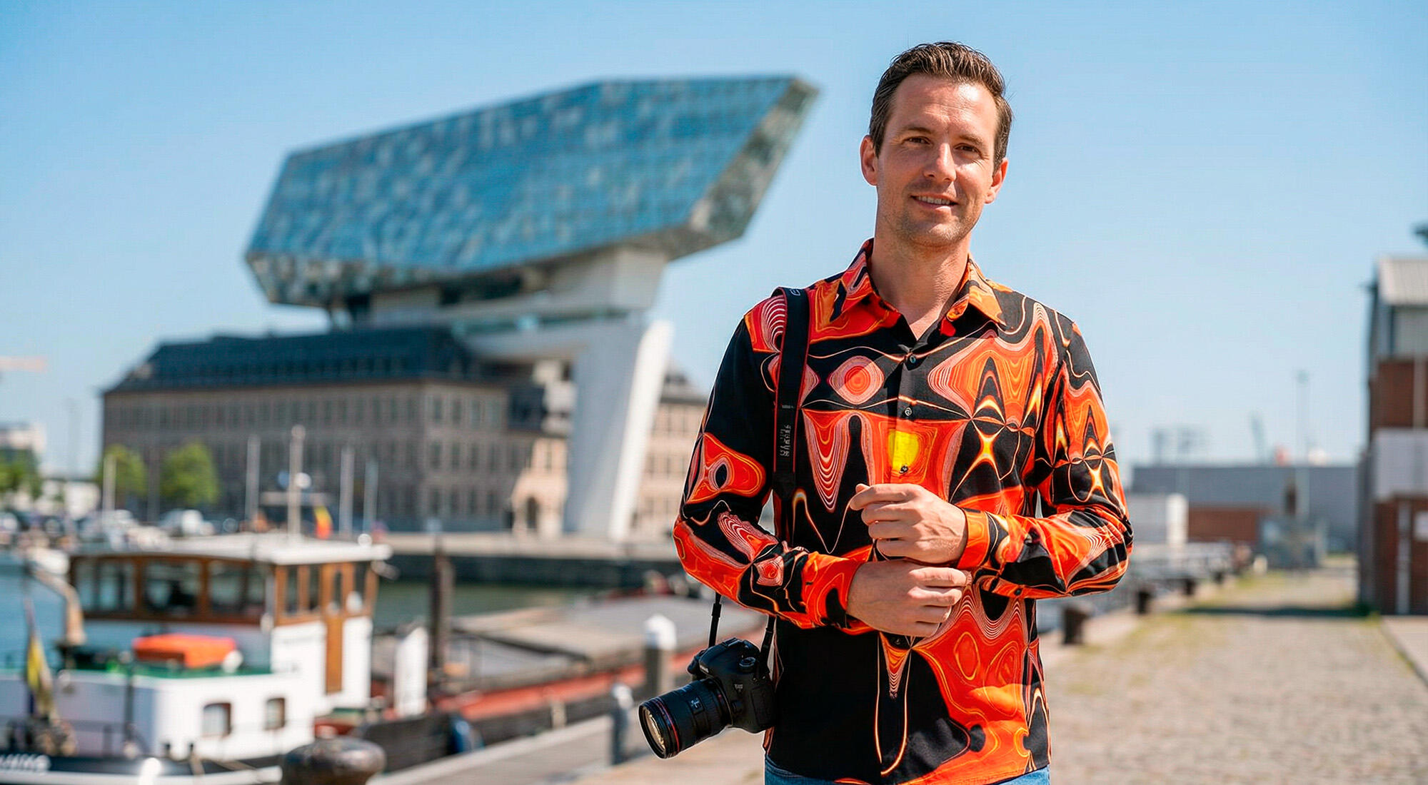 A man wearing a red GERMENS NEW YORK FUNKY shirt out and about in the Belgian city of Antwerp.