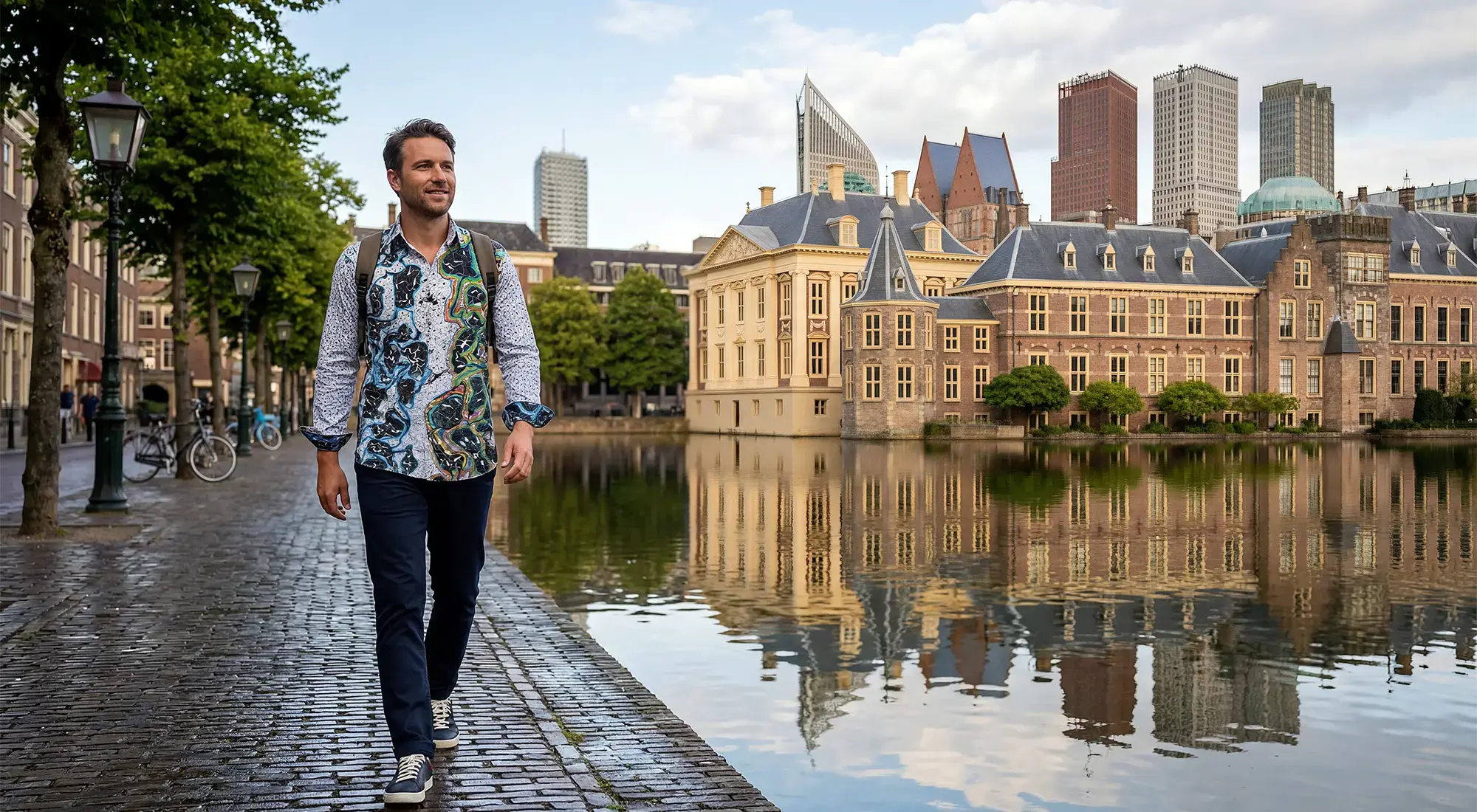A tourist strolls through The Hague wearing the GERMENS ORINOCO shirt.