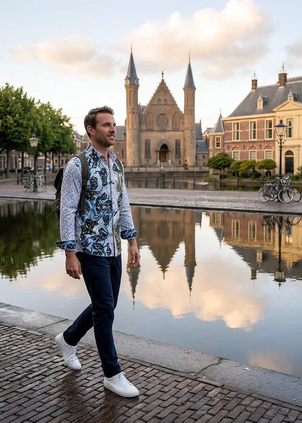 A tourist strolls through The Hague wearing the GERMENS ORINOCO shirt.