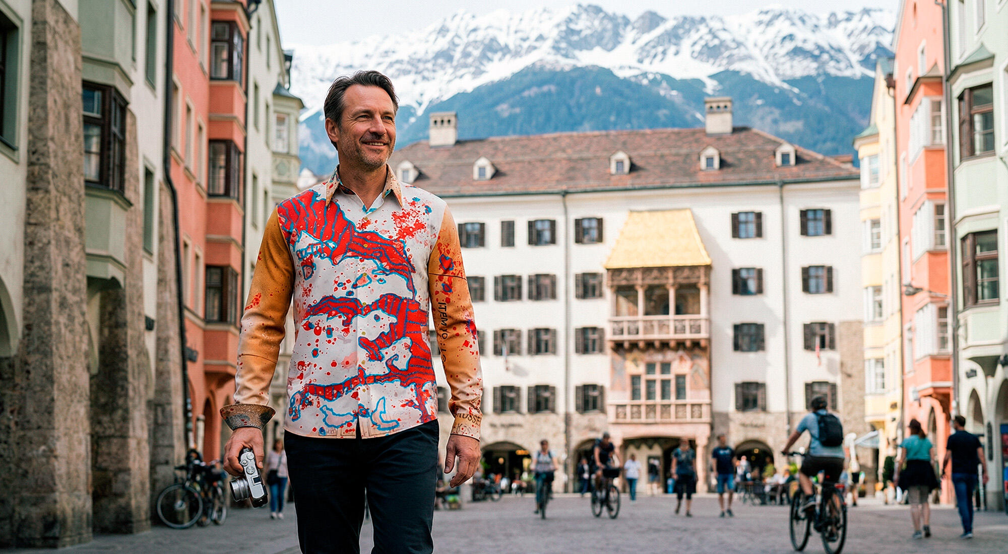 A tourist strolls through Innsbruck, Austria. He is wearing the colorful LAKE BLUE shirt from GERMENS.