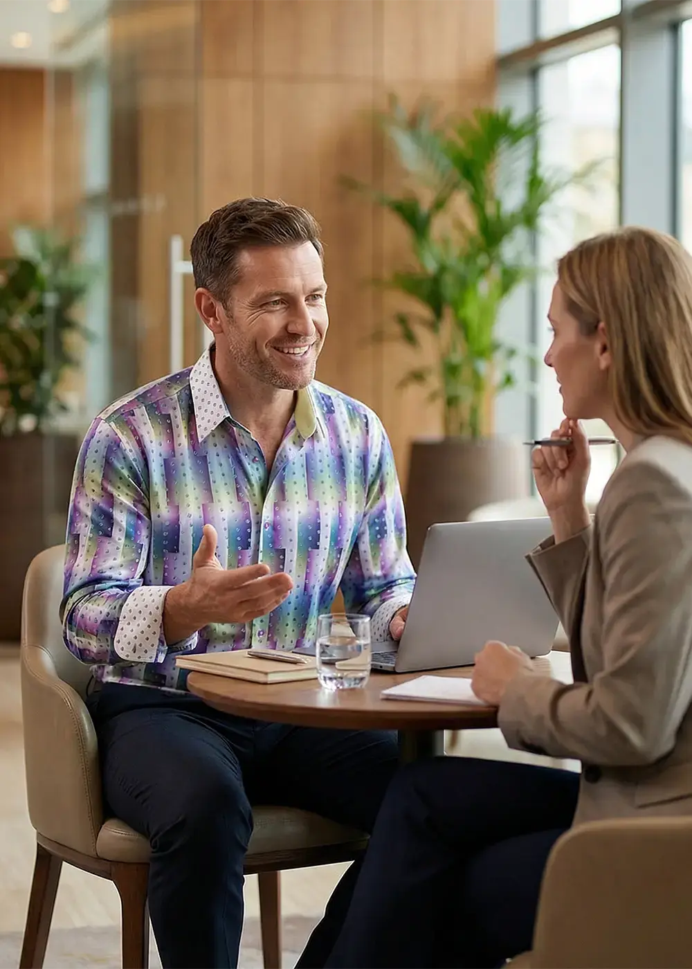 A sales representative in the field during a customer meeting. The man is wearing the GERMENS shirt HYPERLINK